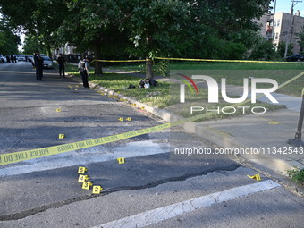 Shell casings are being located at the crime scene on Tuesday afternoon. Two men are in serious condition after being shot in Chicago, Illin...