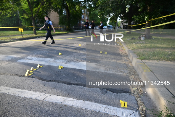 Shell casings are being located at the crime scene on Tuesday afternoon. Two men are in serious condition after being shot in Chicago, Illin...