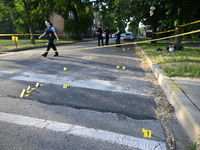 Shell casings are being located at the crime scene on Tuesday afternoon. Two men are in serious condition after being shot in Chicago, Illin...