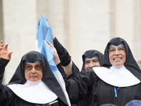 Nuns are waving an Argentinian flag during Pope Francis's weekly general audience in The Vatican, on June 19, 2024, at St Peter's Square. (