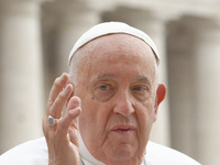 Pope Francis is blessing the crowd as he is arriving to lead the weekly general audience in The Vatican, on June 19, 2024, at St Peter's Squ...