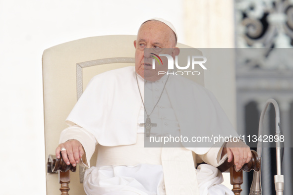 Pope Francis is looking on during the weekly general audience in The Vatican, on June 19, 2024, at St Peter's Square. 