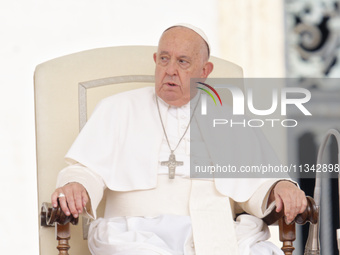 Pope Francis is looking on during the weekly general audience in The Vatican, on June 19, 2024, at St Peter's Square. (