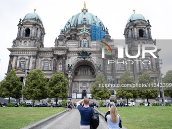 Tourists are visiting Berlin Cathedral in Berlin, Germany, on June 19, 2024. (