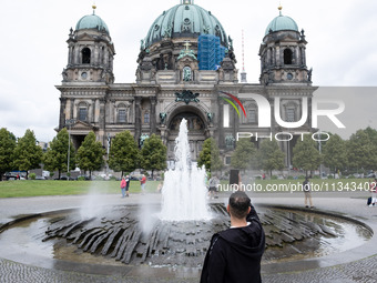 Tourists are visiting Berlin Cathedral in Berlin, Germany, on June 19, 2024. (