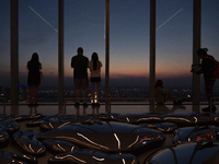 People are enjoying the sunset from the Summit One Vanderbilt observation deck in New York, U.S., on June 18, 2024. The Summit One Vanderbil...