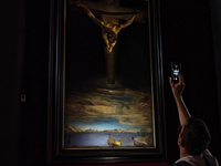 People are taking pictures of ''Dali's Christ'' at San Marcello al Corso Church in Rome, Italy, on June 19, 2024. Salvador Dali's famous pai...