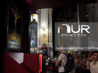 People are taking pictures of ''Dali's Christ'' at San Marcello al Corso Church in Rome, Italy, on June 19, 2024. Salvador Dali's famous pai...