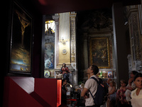 People are taking pictures of ''Dali's Christ'' at San Marcello al Corso Church in Rome, Italy, on June 19, 2024. Salvador Dali's famous pai...