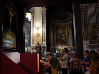 People are taking pictures of ''Dali's Christ'' at San Marcello al Corso Church in Rome, Italy, on June 19, 2024. Salvador Dali's famous pai...