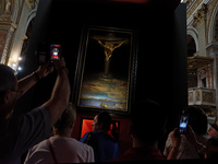 People are taking pictures of ''Dali's Christ'' at San Marcello al Corso Church in Rome, Italy, on June 19, 2024. Salvador Dali's famous pai...