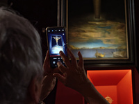 People are taking pictures of ''Dali's Christ'' at San Marcello al Corso Church in Rome, Italy, on June 19, 2024. Salvador Dali's famous pai...