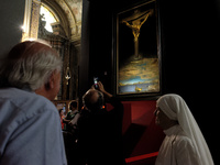 People are taking pictures of ''Dali's Christ'' at San Marcello al Corso Church in Rome, Italy, on June 19, 2024. Salvador Dali's famous pai...