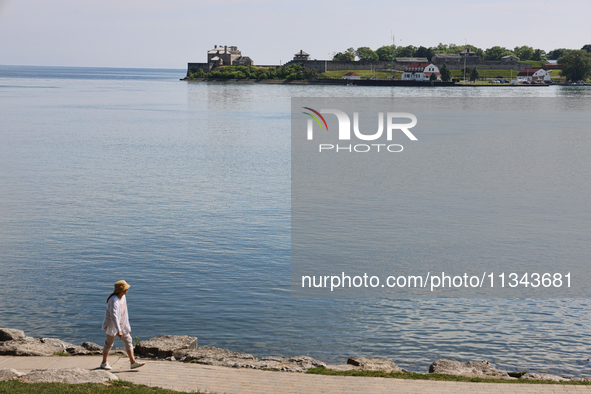 A person is walking along a waterfront trail by Lake Ontario at Queen's Royal Park in Niagara-on-the-Lake, Ontario, Canada, on June 12, 2024...