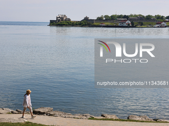 A person is walking along a waterfront trail by Lake Ontario at Queen's Royal Park in Niagara-on-the-Lake, Ontario, Canada, on June 12, 2024...