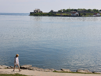 A person is walking along a waterfront trail by Lake Ontario at Queen's Royal Park in Niagara-on-the-Lake, Ontario, Canada, on June 12, 2024...