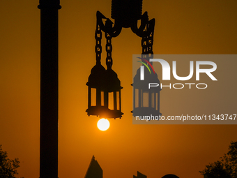 The sunset is illuminating the Doha skyline as seen from Old Doha Port in the warm weather in Doha, Qatar, on June 19, 2024. (