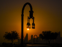 The sunset is illuminating the Doha skyline as seen from Old Doha Port in the warm weather in Doha, Qatar, on June 19, 2024. (