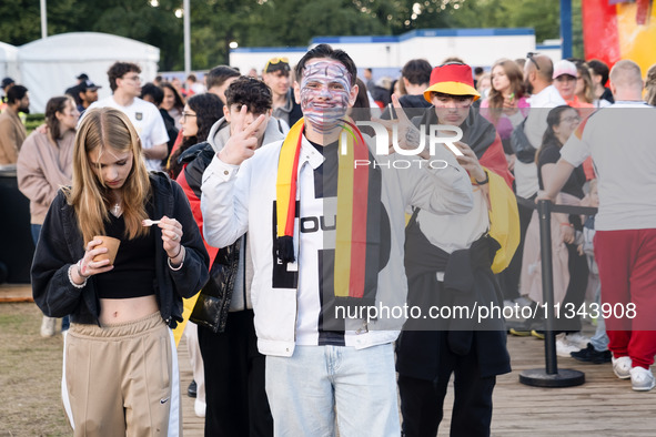 German football fans are celebrating after the Germany vs. Hungary match ahead of UEFA EURO 2024 at a fan base near the Brandenburg Gate in...