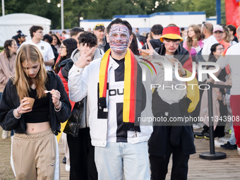 German football fans are celebrating after the Germany vs. Hungary match ahead of UEFA EURO 2024 at a fan base near the Brandenburg Gate in...