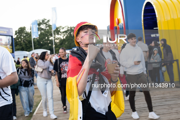 German football fans are celebrating after the Germany vs. Hungary match ahead of UEFA EURO 2024 at a fan base near the Brandenburg Gate in...