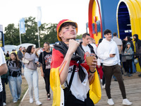 German football fans are celebrating after the Germany vs. Hungary match ahead of UEFA EURO 2024 at a fan base near the Brandenburg Gate in...