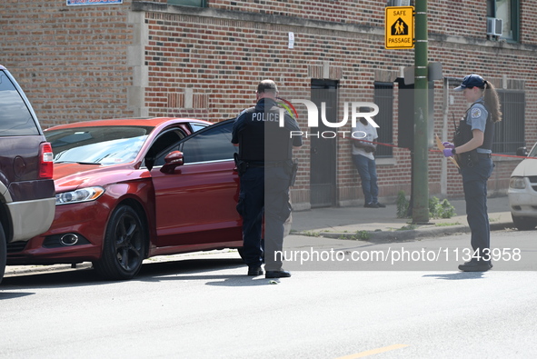 A vehicle is being investigated at the crime scene. A 22-year-old male is being shot multiple times in Chicago, Illinois, United States, on...