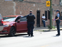 A vehicle is being investigated at the crime scene. A 22-year-old male is being shot multiple times in Chicago, Illinois, United States, on...