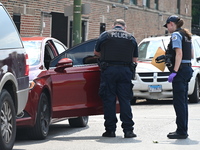 A vehicle is being investigated at the crime scene. A 22-year-old male is being shot multiple times in Chicago, Illinois, United States, on...