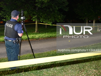 Police are investigating the crime scene. A 49-year-old male is in critical condition following a shooting in Chicago, Illinois, United Stat...