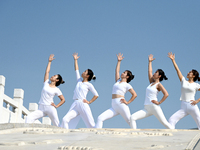 Yoga lovers are practicing yoga at Fengfeng Health Theme Cultural Park in Handan, China, on June 20, 2024. (