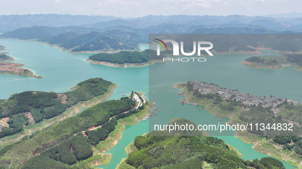 An aerial photo is showing the ecological scenery of Wanfeng Lake in Xingyi, China, on June 20, 2024. 