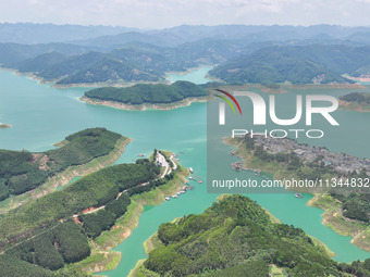 An aerial photo is showing the ecological scenery of Wanfeng Lake in Xingyi, China, on June 20, 2024. (