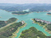 An aerial photo is showing the ecological scenery of Wanfeng Lake in Xingyi, China, on June 20, 2024. (