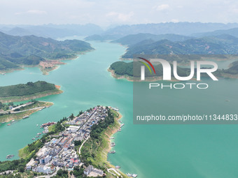 An aerial photo is showing the ecological scenery of Wanfeng Lake in Xingyi, China, on June 20, 2024. (