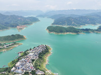 An aerial photo is showing the ecological scenery of Wanfeng Lake in Xingyi, China, on June 20, 2024. (