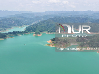 An aerial photo is showing the ecological scenery of Wanfeng Lake in Xingyi, China, on June 20, 2024. (