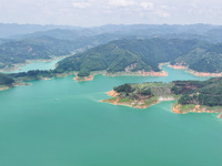 An aerial photo is showing the ecological scenery of Wanfeng Lake in Xingyi, China, on June 20, 2024. (