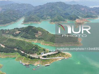 An aerial photo is showing the ecological scenery of Wanfeng Lake in Xingyi, China, on June 20, 2024. (