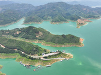 An aerial photo is showing the ecological scenery of Wanfeng Lake in Xingyi, China, on June 20, 2024. (