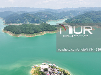 An aerial photo is showing the ecological scenery of Wanfeng Lake in Xingyi, China, on June 20, 2024. (