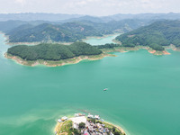 An aerial photo is showing the ecological scenery of Wanfeng Lake in Xingyi, China, on June 20, 2024. (