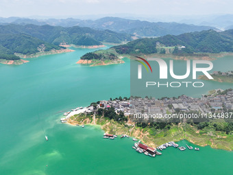 An aerial photo is showing the ecological scenery of Wanfeng Lake in Xingyi, China, on June 20, 2024. (