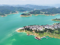 An aerial photo is showing the ecological scenery of Wanfeng Lake in Xingyi, China, on June 20, 2024. (