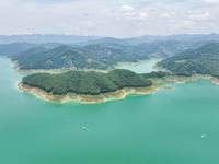 An aerial photo is showing the ecological scenery of Wanfeng Lake in Xingyi, China, on June 20, 2024. (