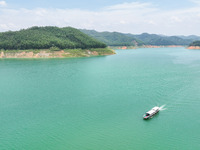 An aerial photo is showing the ecological scenery of Wanfeng Lake in Xingyi, China, on June 20, 2024. (