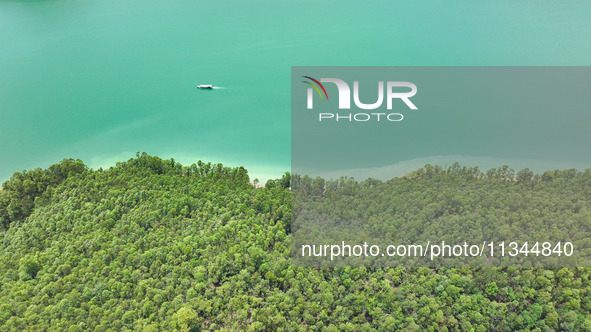 An aerial photo is showing the ecological scenery of Wanfeng Lake in Xingyi, China, on June 20, 2024. 