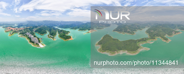 An aerial photo is showing the ecological scenery of Wanfeng Lake in Xingyi, China, on June 20, 2024. 