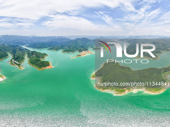 An aerial photo is showing the ecological scenery of Wanfeng Lake in Xingyi, China, on June 20, 2024. (