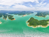 An aerial photo is showing the ecological scenery of Wanfeng Lake in Xingyi, China, on June 20, 2024. (